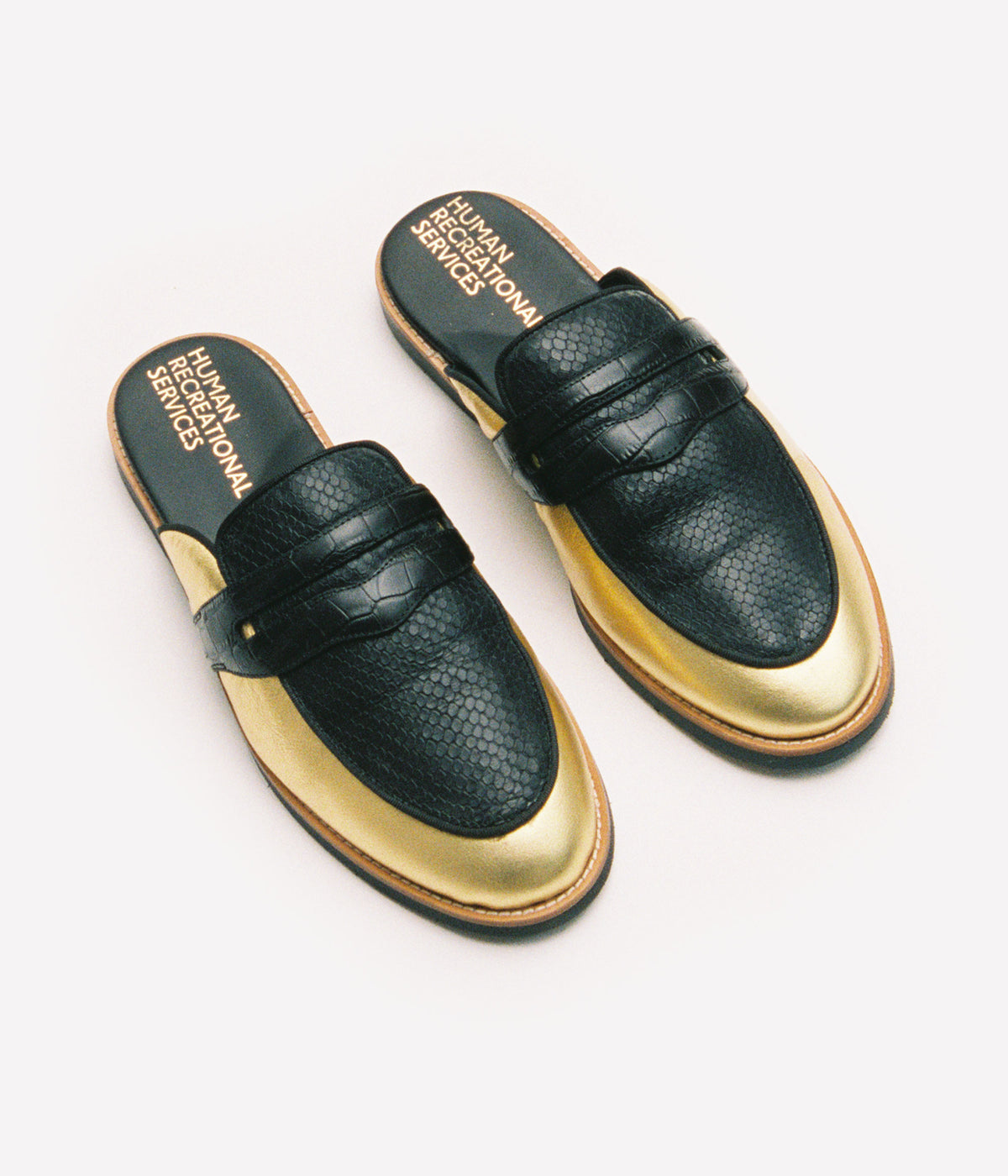 HUMAN RECREATIONAL SERVICES PALAZZO SLIPPER IN GOLD AND BLACK MADE WITH ITALIAN CALF SKIN