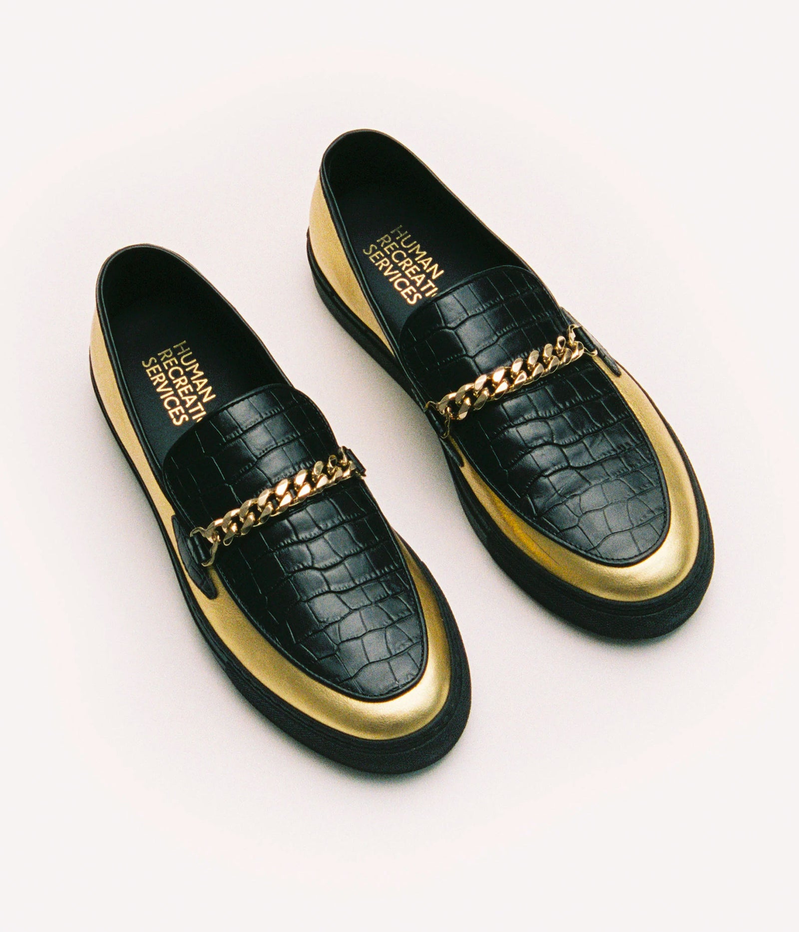 HUMAN RECREATIONAL SERVICES EL DORADO IN GOLD AND BLACK WITH A CUBAN LINK CHAIN