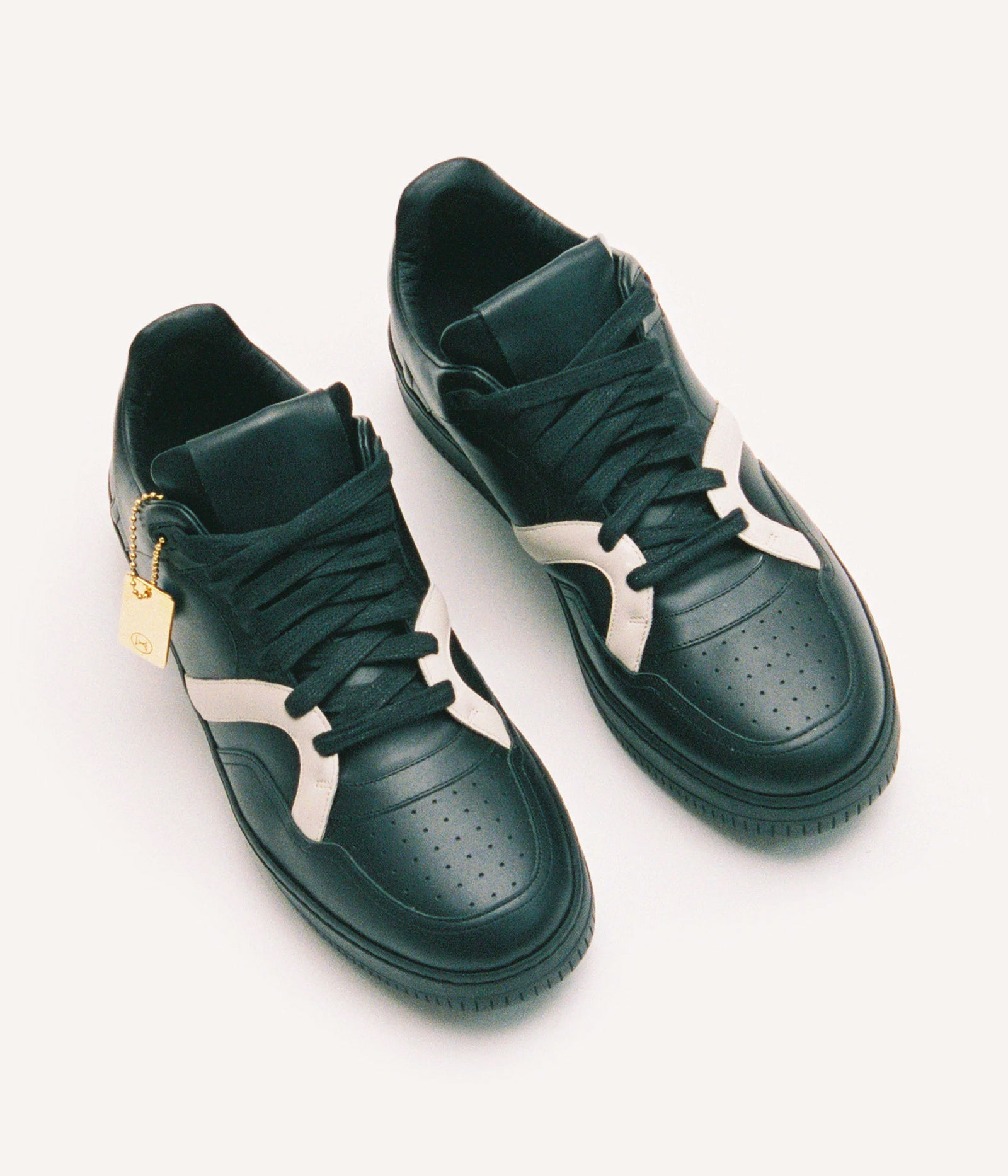 HUMAN RECREATIONAL SERVICES MONGOOSE LOW SHOE IN BLACK AND BONE MADE WITH ITALIAN CALF SKIN